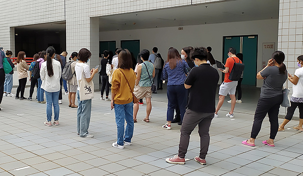 Members of the university queuing up for seasonal influenza vaccination.